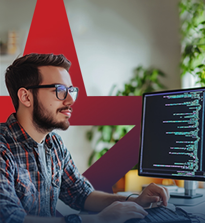 A young man working on computer doing automation design.