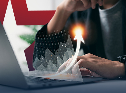 Man working on laptop with overlay graphs showing growth.